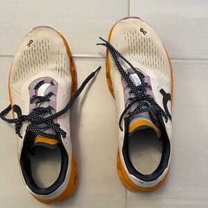 On Running Athletic Shoes in White and Orange